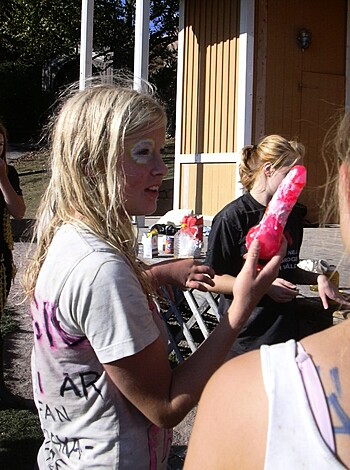 A slender blonde chick is holding a pink-colored dong in her hand with a look of ecstasy on her face, as if she just got fucked by the largest black cock ever.