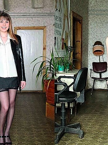 Here's a lim'd description of the image: A bitch in thigh-high stockings and stilettos, draped in a fucking classy blazer.
