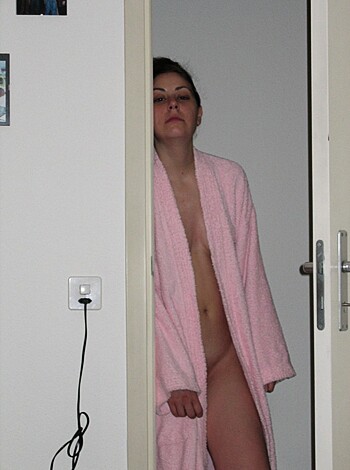"Here's a fucking pic of some slut in a pink robe, ass-out, with her hand over her mouth like a bitch in heat, acting all shy and shit."