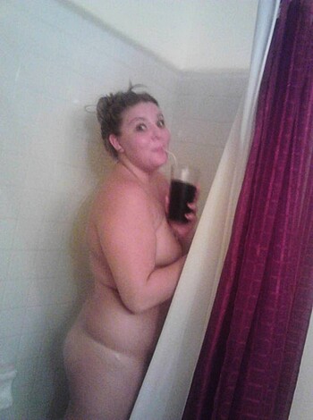 A horny bitch is taking a goddamn shower with her tits and pussy exposed, just waiting for some dude to fuck her raw, or at least give her some sweet ass orgasms from behind.