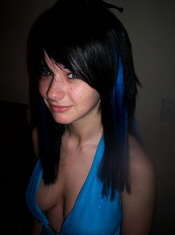 A fucking hot chick in a skimpy piece of blue panties, posin' for the camera.