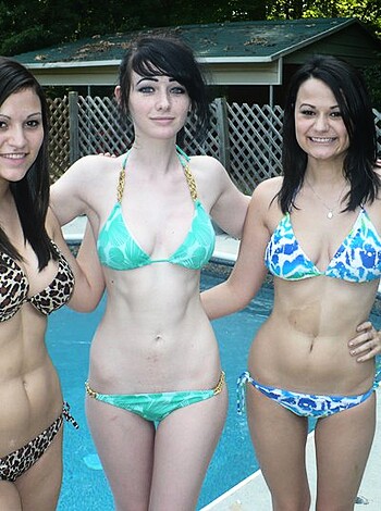 """
A fucking bunch of hot sluts wearing skimpy swimsuits, exposing their toned bodies on the beach.
"""