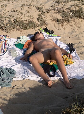 "Fuckin' hell, man! Look at this dickhead lying naked on the fuckin' sand with his shit-hole open for all to see."