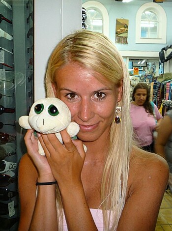 Vulgar description:
"A fucking dumbass bitch holding her plastic shit of a toy."