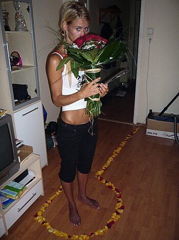 "Check out this chick holding some fucking flowers while standing on some boring-ass wood floors."