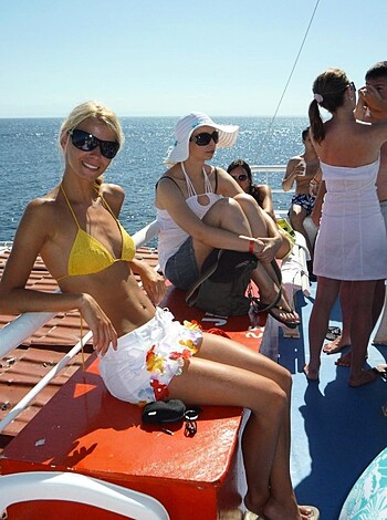 The nude chick perched on a sailboat in her pussy.