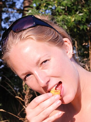 """
Fuckin hot bitch munchin on some chips naked in the fucking great outdoors, yo!
"""