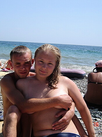 """
Half-naked dude and chick humping on the sandy shore, all up in each other's business.
"""