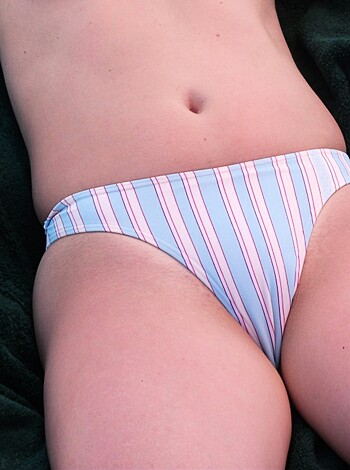 Here's a fucking close-up shot of some cunt's tight ass crack showing through her flimsy-ass panties, you goddamn perv.