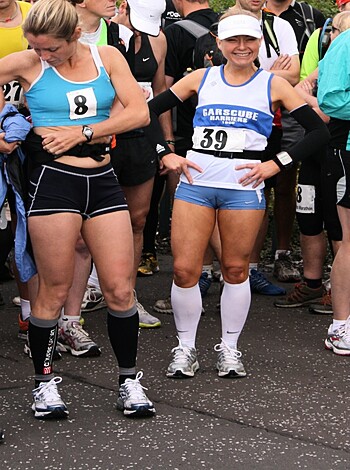 Here's a picture of two chicks in sweats standing next to each other like they want to bone.