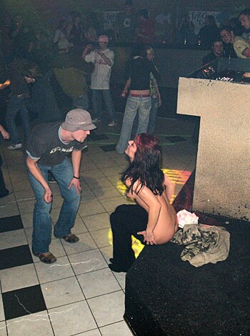 A naked bitch on her fucking knees sucking off some dude.