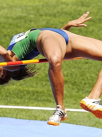 Here's a vulgar description of the photo: Fucking bitch in a sexy bathing suit doing a fucking hot shit on some motherfucking green ass grass.