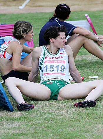 Runt in the butt, ass up, another runner grabs her bum, squeezing it tight on the ground, after finishing a run.