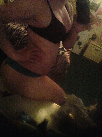 "Bitch taking a nip slip pic of her boobs & snatch."