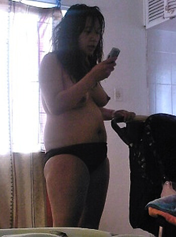A fucking nude bitch standin' in her bedroom.