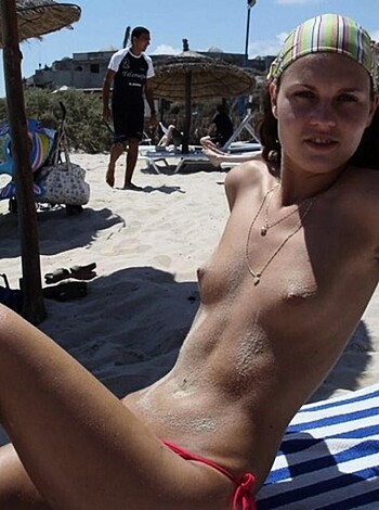"This image of a hot chick lying on the sand, her nipples poking through her bikini top."