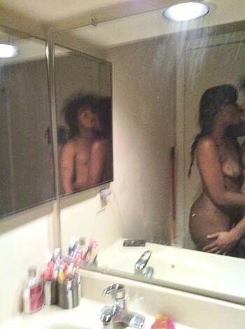 The nude man and woman in front of a fucking bathroom mirror with no clothes on, stroking their dicks, getting ready to bone, probably not caring about hygiene or cleanliness because they're so goddamn horny.
