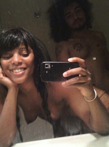 A couple banging in the can while half-dressed, their genitals and asses on full display.