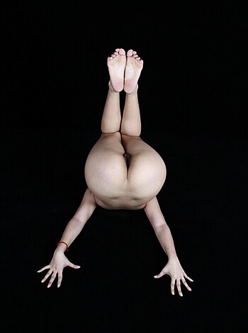 Vulgar description of image: "Fuckin' hot bitch with her shaved pussy lips and titties dangling from the ceiling while she holds onto her fucking ankles like a motherfuckin' amateur porn star."