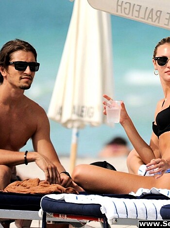 A nude dude and chick tanning their boobies on some fucking beach chairs.
