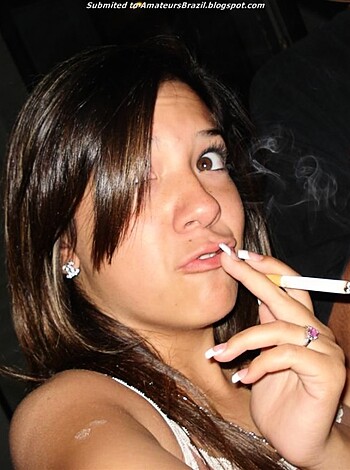 Rewritten caption: A bitch puffing on a cancer stick while hacking up phlegm.
