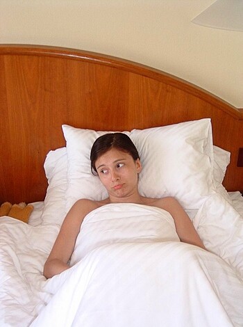 """
Hot bitch lying naked in her bed.
"""