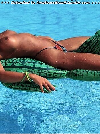 A fucking bitch is getting pounded by an alligator swimming pool float, with her tits and ass out for everyone to see.