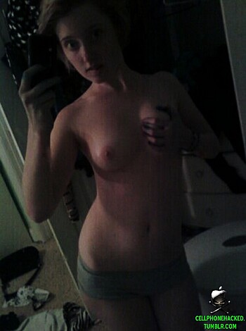 "Check out this fucking hot chick taking a sexy selfie while flashing her tits and pussy for all the world to see. What a fuckin' hottie."