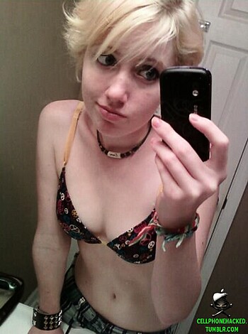 "Mirror shot of a chick's bare tits and midriff while she takes a fucking selfie."
