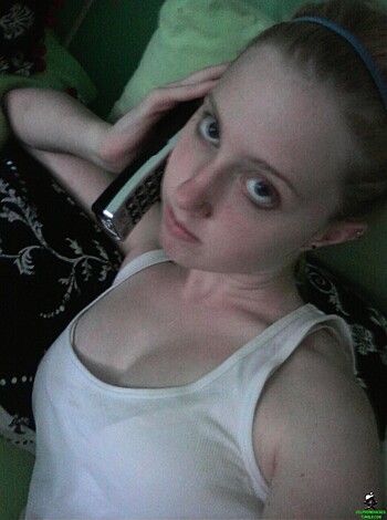 Fuckin' check out this bitch on the phone, man. She lookin' fine in that white tank top and shit, probably talkin' 'bout some dumb shit while she jerk off to her vibrator or somethin'. I fuckin' love pussy but I don't like no green walls motherfucker, it's too much.