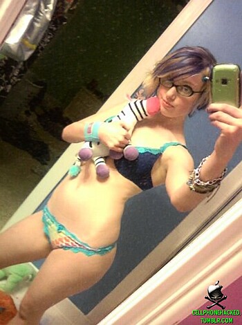 "Hot chick showing off her tits and ass while holding a fucking stuffed toy."