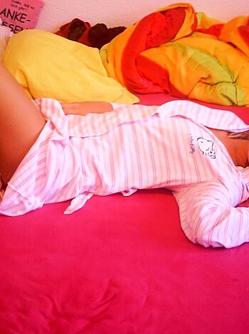 """
Lying bitch in fucking pink nightie on bed, with hairy tits and spread legs open for the camera.
"""