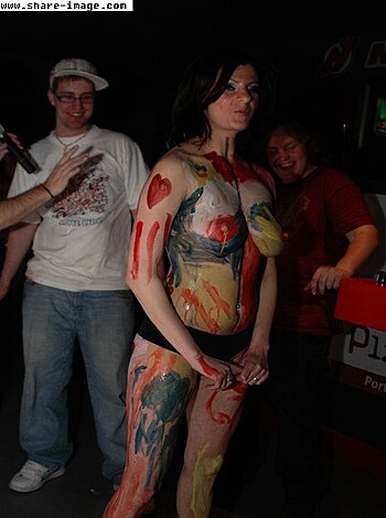 """
Fucking hot naked chick covered in body paint, showing off her tits and pussy.
"""
