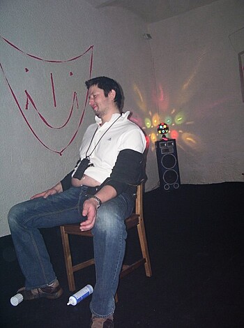 "Take a fucking look at this retarded motherfucker grinnin' like a goddamn idiot in his goddamn white shirt, jeans and shoes with his fucking beard all over the place while he sits on his fucking ass. I mean, seriously?"