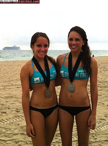 Two chicks at the beach; one's got a fucking medal, while the other doesn't even have a bra on.