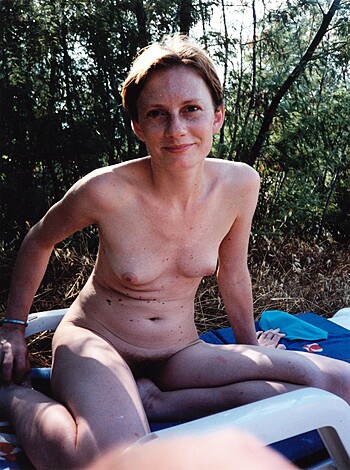 "Check out this slutty hoe with her pussy hanging out while sitting nude on a fucking towel, bro."
