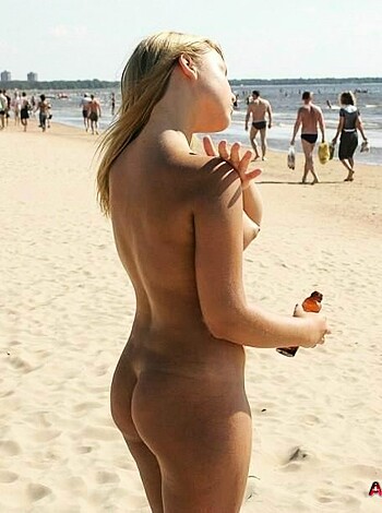 "A fucking nude chick with her twat and tits hanging out on the shore."