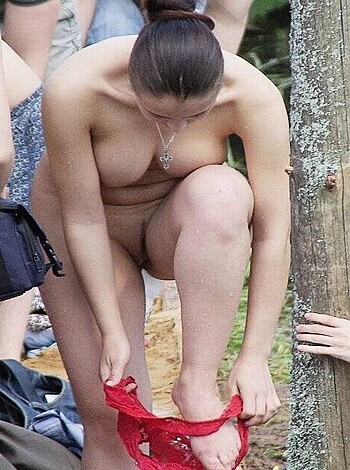 "Hot chick with nothing on her tits but a red thong, bent over so you can see her ass."