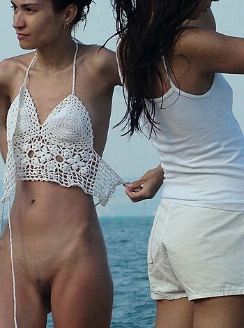 "Girl on beach without top, tits out, laughing next to slut in just a fucking t-shirt and bitch shorts."