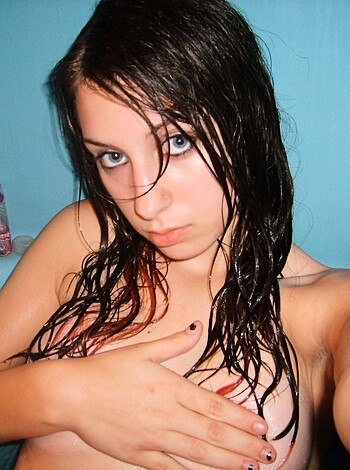 Fucking hot bitch in the bathtub, covering her tits with her fuckin' hands.