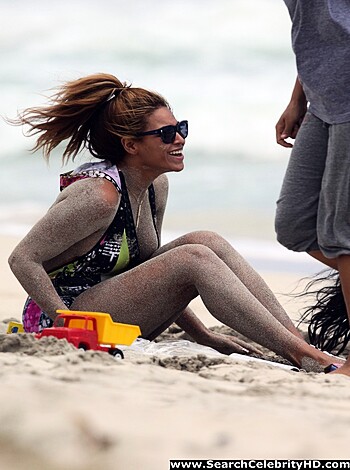 This bitch on the beach got fuckin' sand all up her pussy, laughin' like some stupid cunt while her dick-suckin' boyfriend watches.