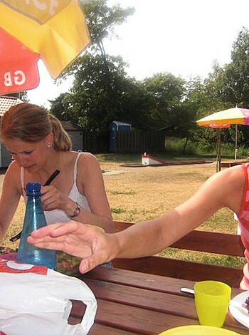 "Grab your f*ckin' ass and check out these two chicks eating their lunch on a shitty picnic table."