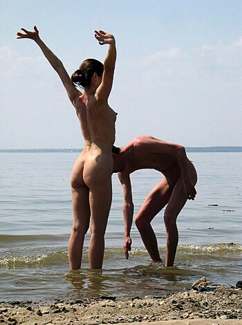 A naked dude and chick on the shore, with their arms akimbo, shuffling their asses.