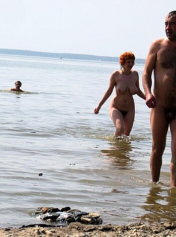 "Here's a description of a couple fucking nude at the shore, with full exposure of genitals."