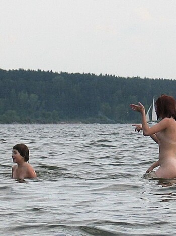 """
Horny individuals soaking wet and nude in aquatic environment.
""