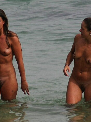 Fuckin hot bitches strutting their tits and asses on the fucking sandy shoreline, totally nude and soaking wet, showcasing those juicy jugs and firm asses as they sashay past the goddamn water.