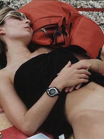 This is a shot of some slutty bitch sunbathing on the fucking beach with her tits out, while probably getting ready to fuck any random dude who approaches her.