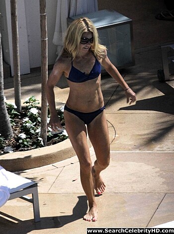 This is a fucking picture of a cunt-ass bitch wearin' some skimpy-ass bikini shit.