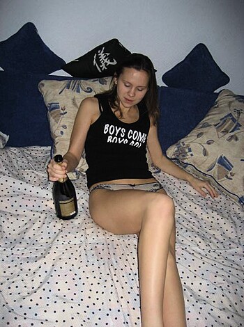 "Fucking hot naked chick w/ her pussy showing, lying on bed w/ her legs spread."