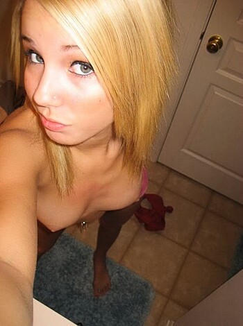 Naked babe with nipples and pussy on display.
